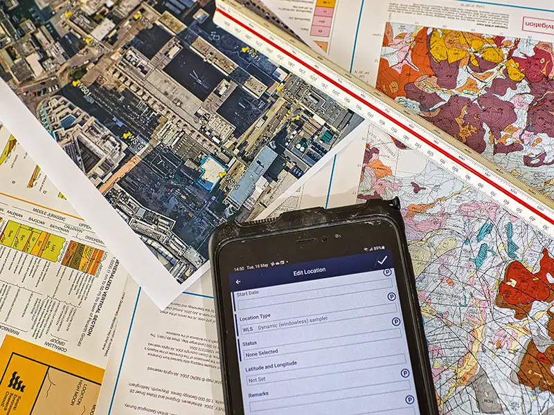 site maps, plans and surveys on a table